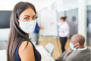 Young business woman in face mask, Covid-19