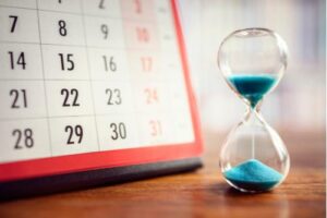 Calendar and hourglass, workers' comp deadline in Florida concept