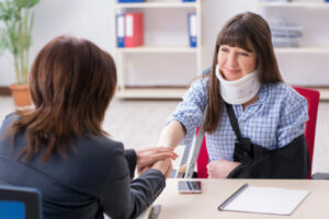Injured woman visiting workers' comp lawyer