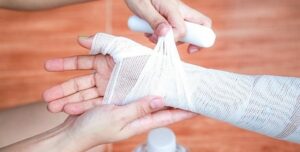 bandaged hand, workers compensation concept image