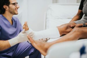 workers' compensation doctor checking female patient