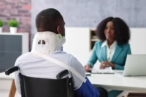 Worker with neck injury meeting worker's compensation lawyer