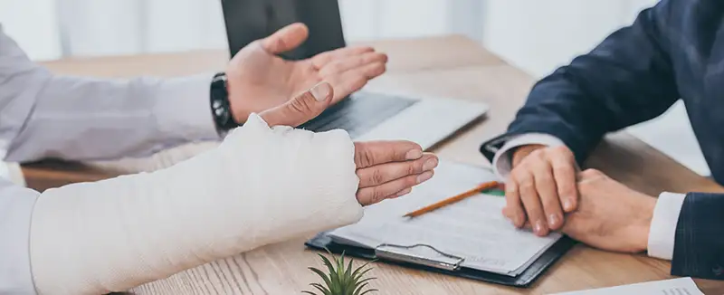 Boca Raton workers comp attorney meeting with client