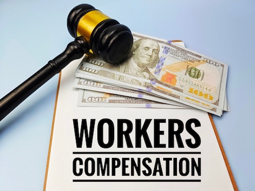 Workers' Comp Settlement Concept With Money and Gavel