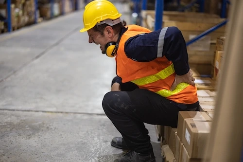 Fontainebleau warehouse worker with excruciating back pain