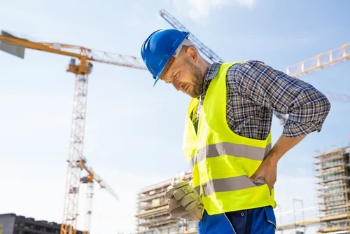 Construction worker with an injured back on the job site